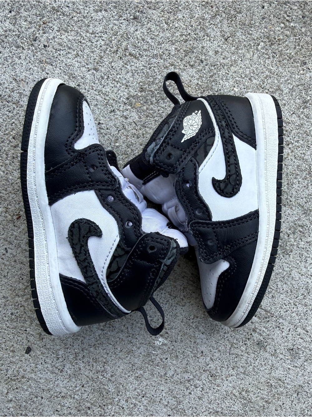 Jordan 1 Mid SE "Panda Elephant" toddler sneakers in a black and white colorway